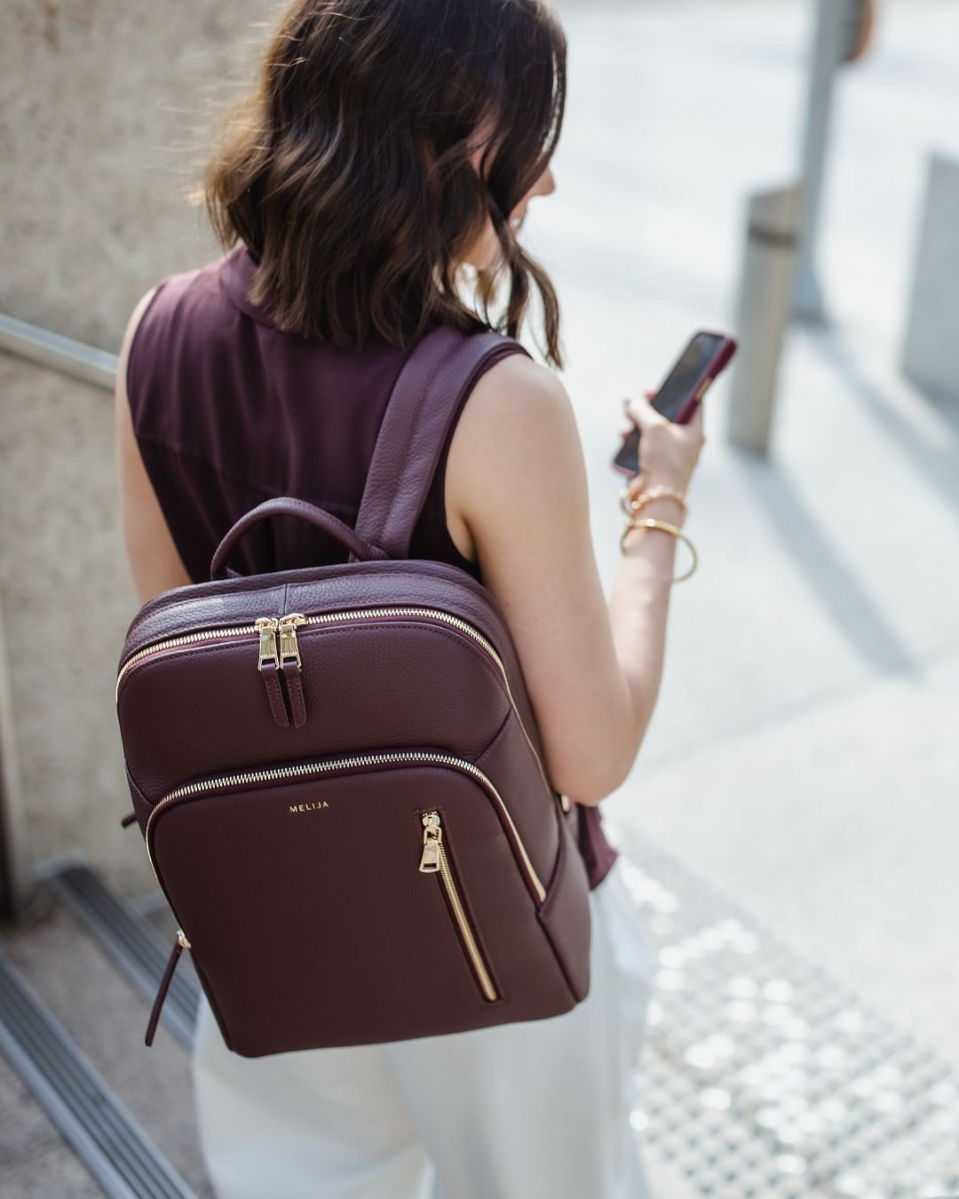 Traveller wearing a backpack at a mountain viewpoint