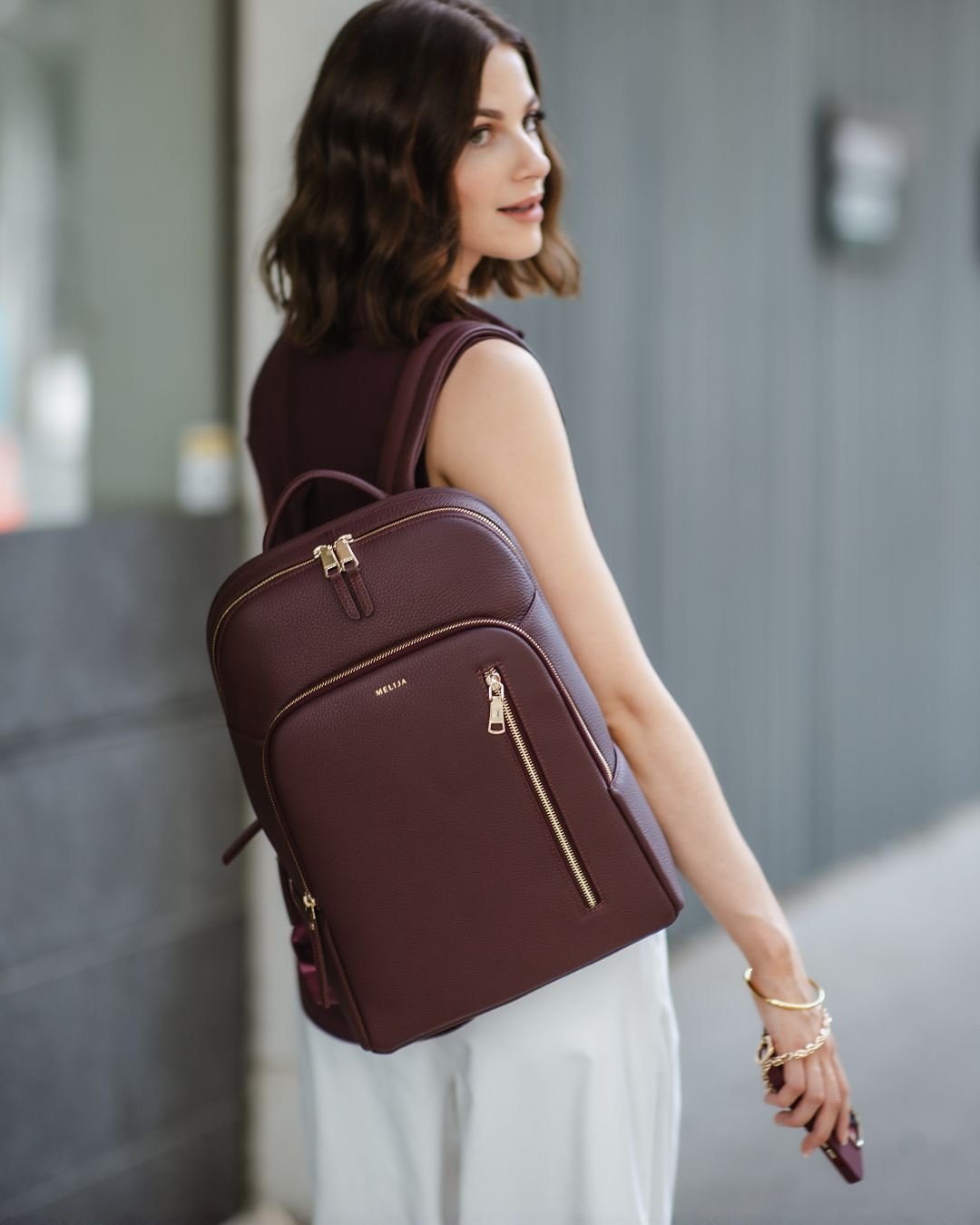 Traveller wearing a backpack at a mountain viewpoint