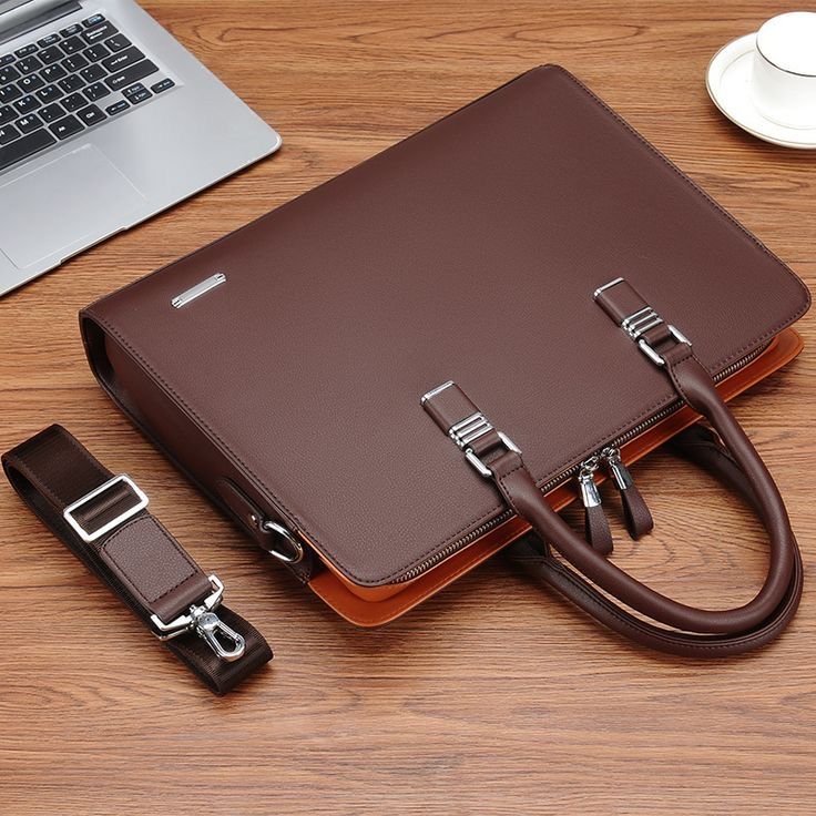 Business traveller with laptop bag in a modern office